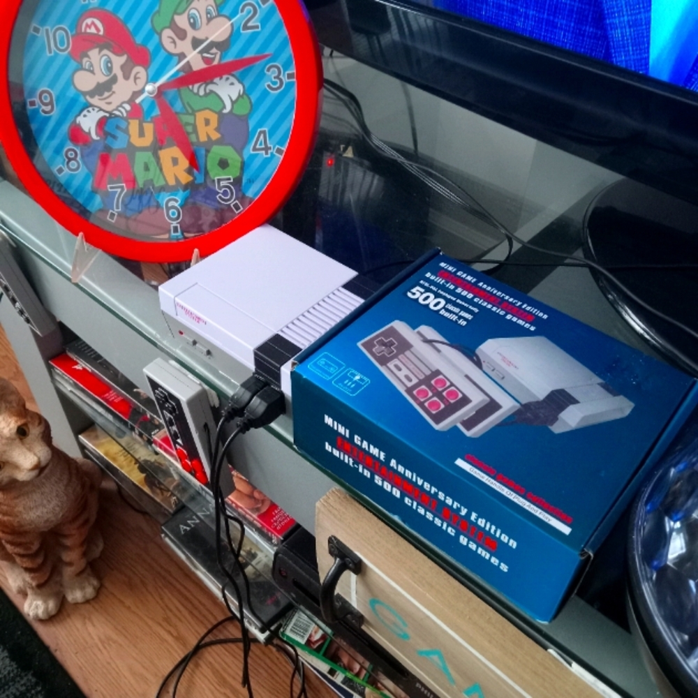 Nintendo 500 game with controller Mario clock and game system with game plaque